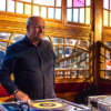 Photo of Paul Cater infront of his decks.