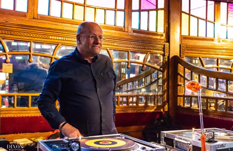 Photo of Paul Cater infront of his decks.