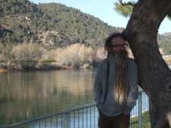 Photo of Paul Taylor leaning on a tree in Benifallet.